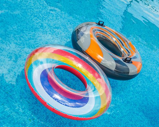 inflatable water activities circles tuba float on the water in the pool concept fun perky summer and relaxation